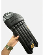 DuL DuL Batting Pads in black shown from a side angle with straps visible.