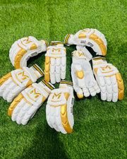 Manger Gold Edition batting gloves with padded palms and finger protection.