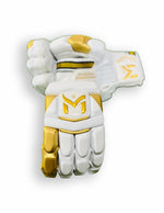 Manger Gold Edition batting gloves showing padded finger protection and adjustable wrist strap in a close-up view.