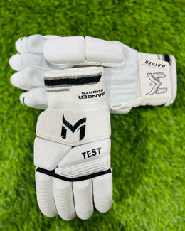 Manger Test Edition batting gloves with black and white design, padded palms, and adjustable wrist straps.