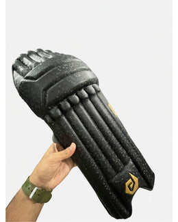 DuL DuL Batting Pads in black shown from a side angle with straps visible.