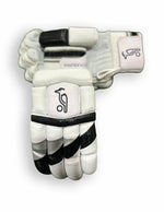 Black and grey Kookaburra batting gloves with padded palms and adjustable wrist straps for cricket protection.