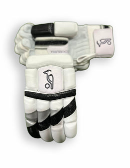 Black and grey Kookaburra batting gloves with padded palms and adjustable wrist straps for cricket protection.