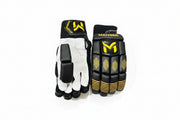 White and gold Manger batting gloves for beginners, showing the padded design and adjustable wrist straps.