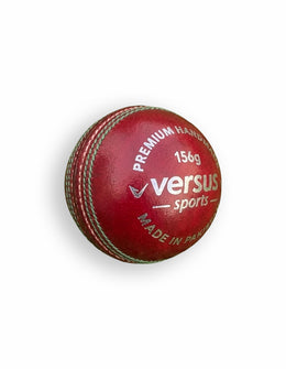 Red Versus Club Match Ball showing the textured surface and vibrant red color, designed for professional soccer matches.